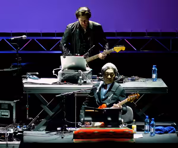 Bass player Haruomi Hosono playing a London concert with Yellow Magic Orchestra in 2008