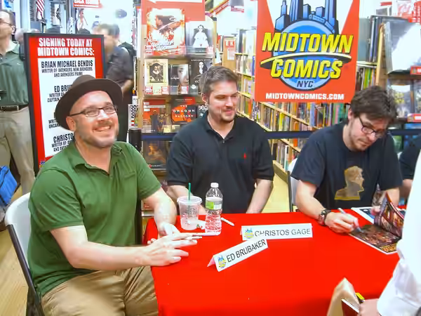 From the left to right: Writers Ed Brubaker, Christos Gage and Matt Fraction at a book signing at Midtown Comics Times Square in Manhattan, June 21, 2010. Photo