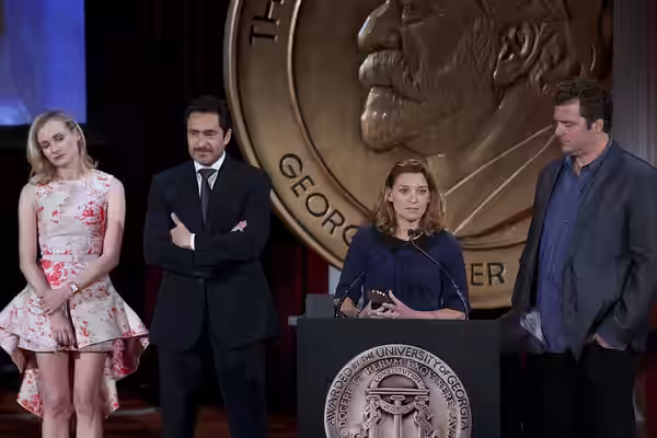 Demian Bechir and Meredith Stiehm accept the Peabody Award for The Bridge. (2014)