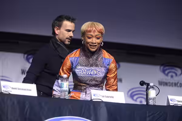 Christopher Gorham and Tati Gabrielle speaking at the 2023 WonderCon, for "Batman: The Doom That Came to Gotham", at the Anaheim Convention Center in Anaheim, C