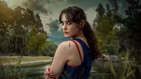Miki Anderson is looking straight into camera with Savage River behind her and blood on her hands. (2022)