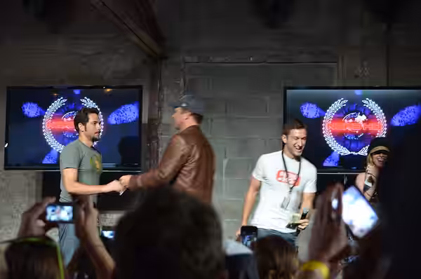Adam Baldwin buys a kiss from Zachary Levi (2012)