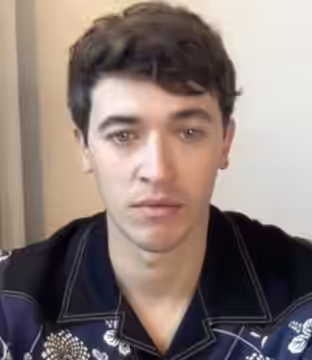 Tom Blyth being interviewed in May 2022