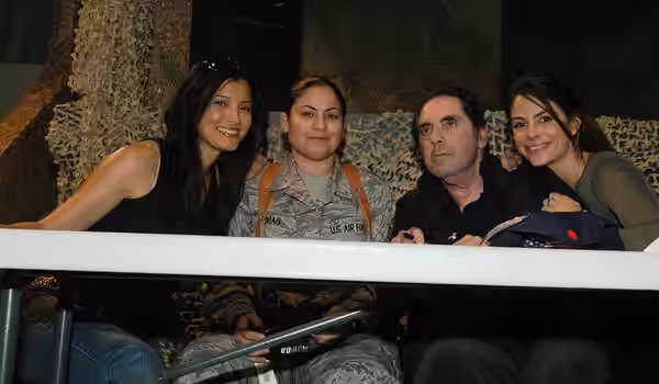 Senior Airman Ashley Thomas, Task Force Paladin personnel clerk, poses with Kelly Hu, David Proval and Maria Menounos during an MWR visit, March 16, at Bagram A (2008)