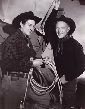 Publicity photograph for the film Wagon Master (1950) showing Ben Johnson and Harry Carey, Jr..