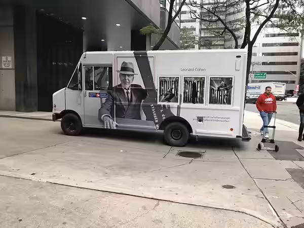 A Canada Post delivery vehicle with Leonard Cohen commemorative stamp decals. Vehicle #53889, Ontario license plate 546 9NH. At alley outside 1 University Avenu (2019)