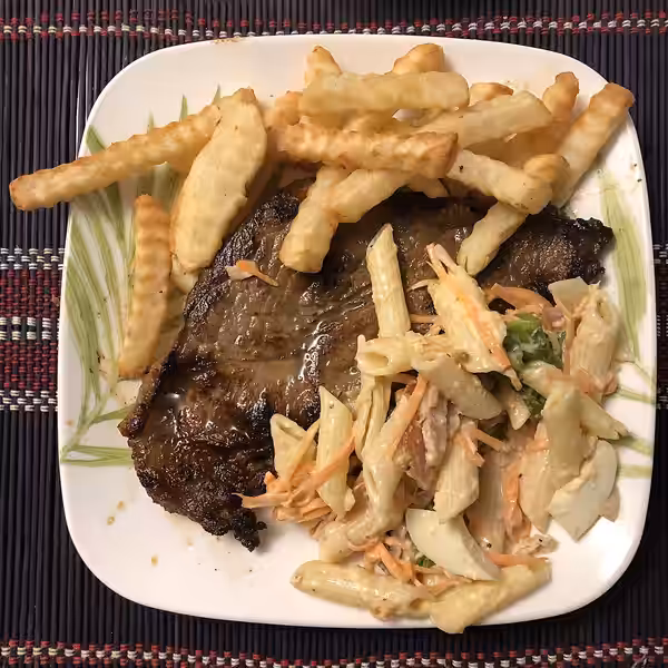 Roast Steak combines with Pasta Salad, Eggs and Chips on the Dish (2021)