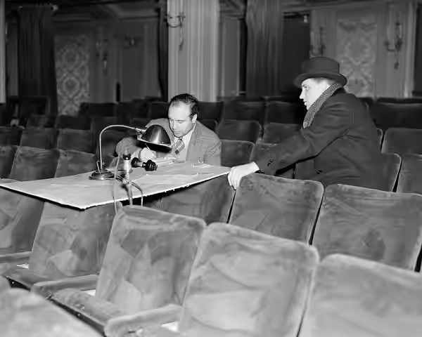 Photograph of John Houseman and Philip W. Barber in Maxine Elliott's Theatre during preparations for the Federal Theatre Project 891 production of Doctor Faustu