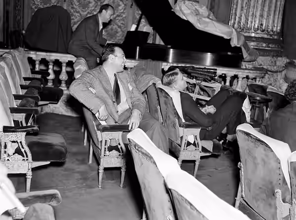 Photograph of (from left) Virgil Thomson, John Houseman and Edwin Denby during a rehearsal of the Federal Theatre Project production of Horse Eats Hat at Maxine (1936)