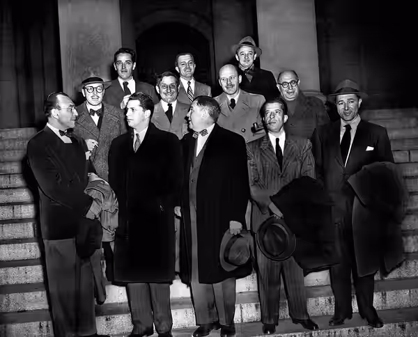 Ten Hollywood personalities, the “Hollywood 10,” stand with their attorneys outside district court in Washington, D.C., Jan. 9, 1948 before arraignment on conte