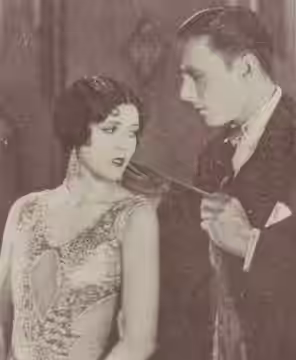 Still from the American comedy film Fig Leaves (1926) with Olive Borden and George O'Brien, from the February 1927 Cinelandia.