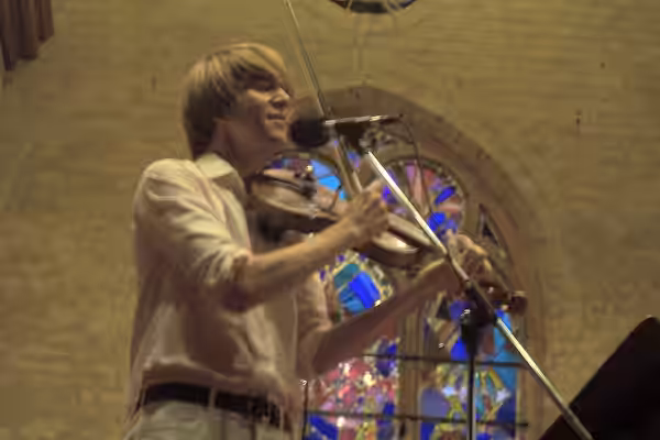 Owen Pallett of Final Fantasy, music gallery June 25 2005. The church has pretty stained glass.Final Fantasy