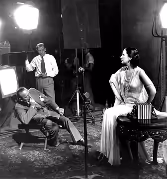 Photo of Michael Curtiz planning for photography of Lil Dagover during filming I Spy (later titled The Woman from Monte Carlo) Ernest Haller (center) was the fi (1932)