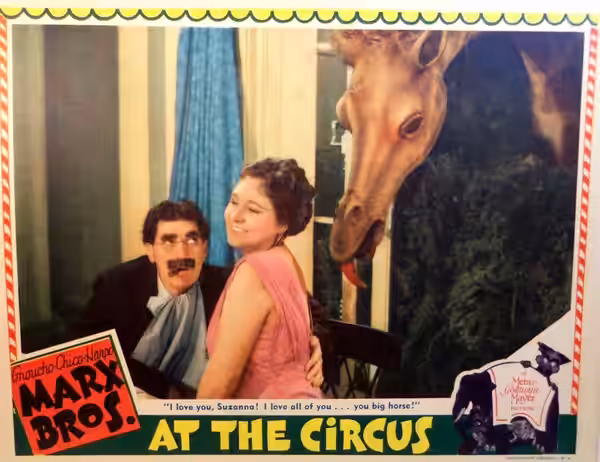 Lobby card for the American comedy film At the Circus (1939). Pictured are Groucho Marx and Margaret Dumont.