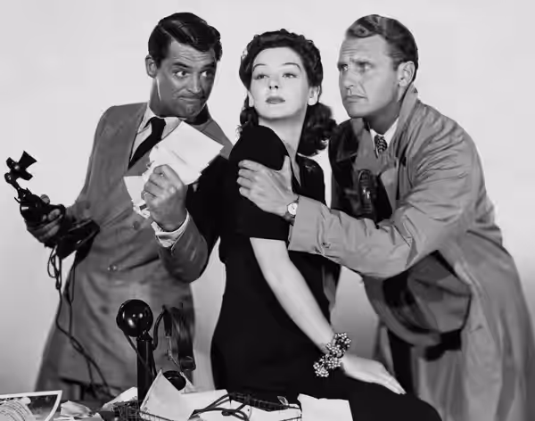 Promotional photo from the 1940 film His Girl Friday. Rosalind Russell is wearing a costume designed by costume designer Robert Kalloch. Due to a failure to ren