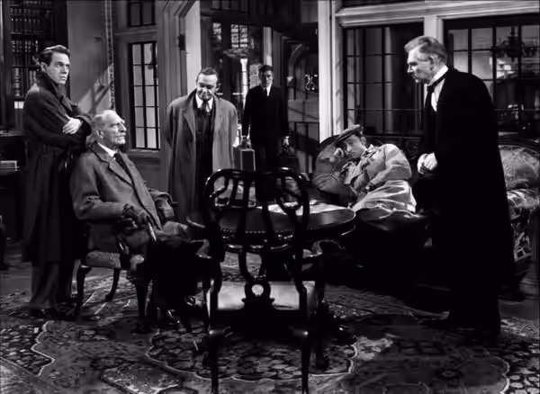 Left to right: Louis Hayward, C. Aubrey Smith, Barry Fitzgerald, Richard Haydn, Mischa Auer, and Walter Huston in And Then There Were None (1945)