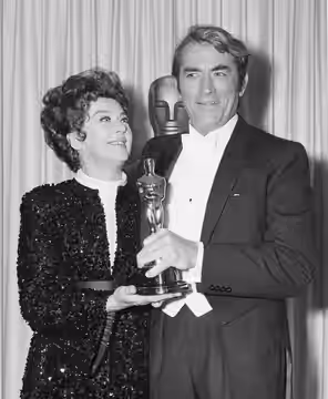 Rosalind Russell presents Jean Hersholt Humanitarian Award to Gregory Peck. No copyright notice. (1968)