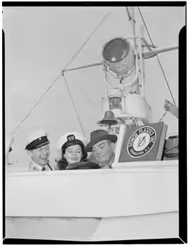 Gottlieb, William P., 1917-, photographer. [Portrait of Cliff Edwards, Betty Brewer, and Frank Raye, Ukelele Lady (yacht), Hudson River, N.Y., ca. June 1947] 1 