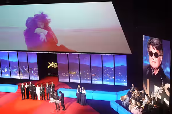 Director Jafar Panahi accepting Palme d'Or for Un Simple Accident at Cannes 2025