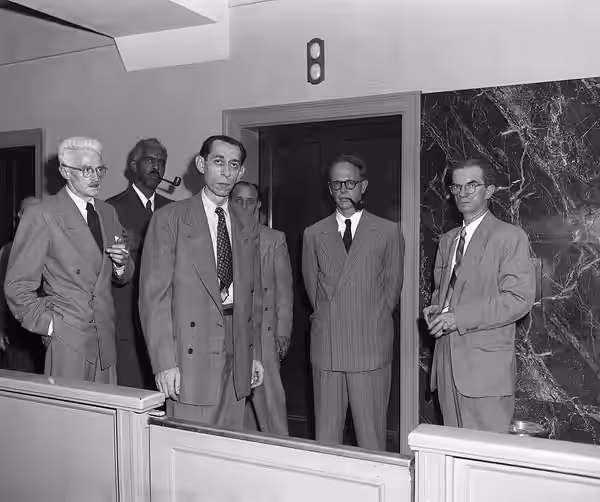 New York, Ny: Dashiell Hammett (1894-1961) Alpheus Hinton, Abner Green, Fredrick Vanderbilt Field, and unidentified U.S. Marshall. (1951)