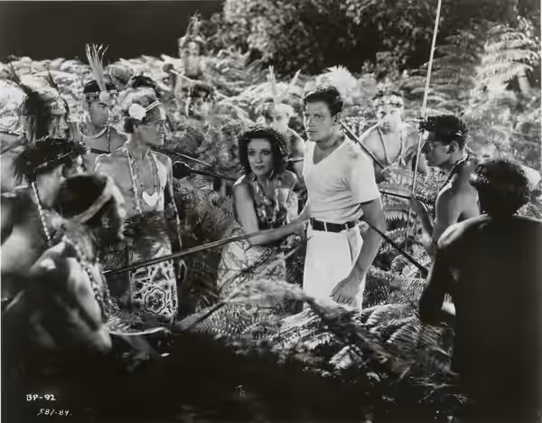 Dolores del Río and Joel McCrea (center) in Bird of Paradise (1926) - cropped screenshot (1932)