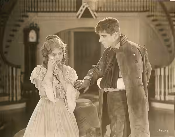 A scene from the American drama film Secret Service (1919), which played at the Coliseum Theater, Seattle. Includes Robert Warwick and Wanda Hawley. Date stampe