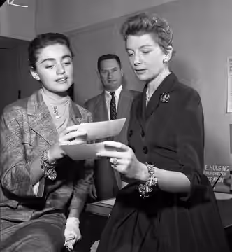 Actresses Anna Maria Alberghetti and Deborah Kerr re-registering for alien registration month at the U.S. Immigration Service's headquarters in Los Angeles. Sta (1957)