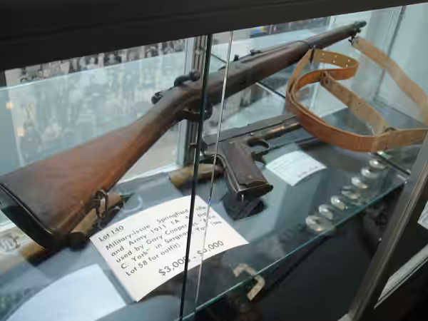 Military-issue Springfield rifle and Army 1911 1A .45 pistol used by Gary Cooper in "Sergeant York" at the Debbie Reynolds Auction Breaks Up Historic Hollywood  (2011)