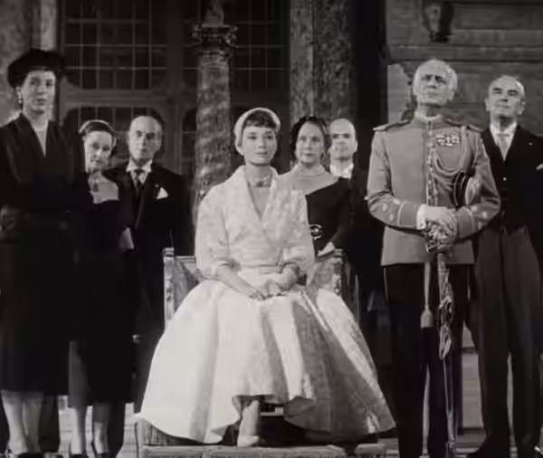 L. to R. (foreground) : Margaret Rawlings, Audrey Hepburn &amp; Tullio Carminati in Roman Holiday - trailer (cropped screenshot) (1953)