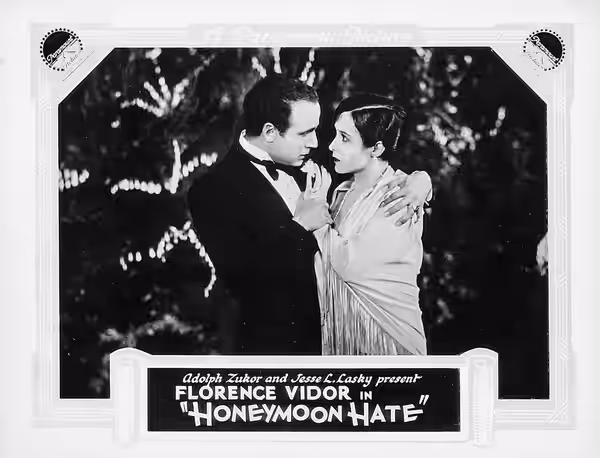Lobby card for the American romantic comedy film Honeymoon Hate (1927).