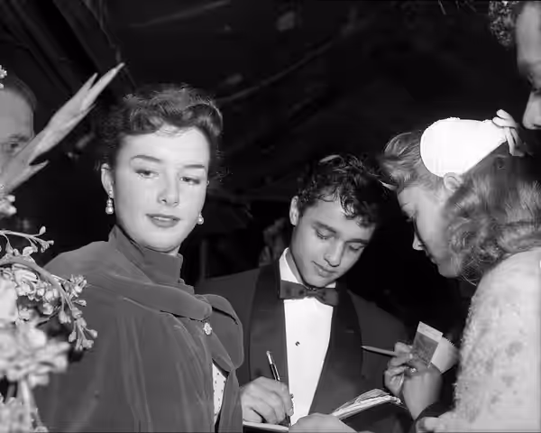 Actors Sal Mineo and Gigi Perreau at the premiere of The Man in the Gray Flannel Suit in Grauman's Chinese Theatre (1956)