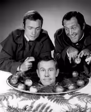 Publicity photo for the Friars' Club of California roast of Johnny Carson. Pictured standing are Dick Cavett (left) and Alan King. The roast was televised. (1968)