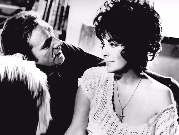 Photo of Richard Burton and Elizabeth Taylor from the 1973 ABC made for television movie Divorce His. In 1972, Richard Burton and Elizabeth Taylor signed with A
