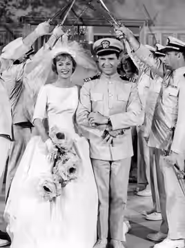 Photo of Abby Dalton and Jackie Cooper from the television program Hennesey. The wedding of Martha Hale and Chick Hennesey was also the end of the series. (1962)