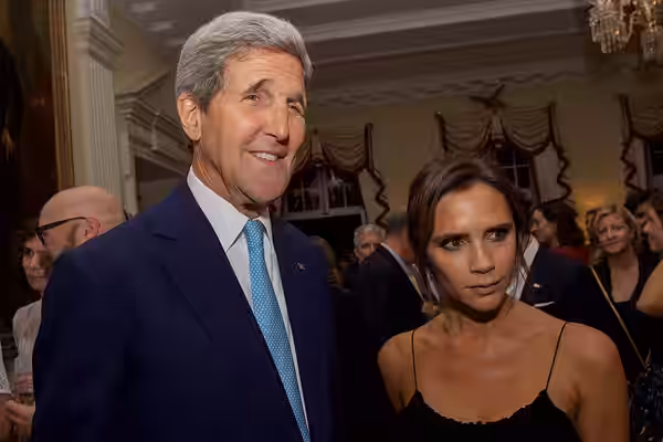 U.S. Secretary of State John Kerry poses for photographers with singer and fashion icon Victoria Beckham at Winfield House - the U.S. Ambassador's Residence in  (2015)