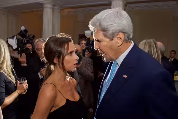 U.S. Secretary of State John Kerry speaks with singer and fashion icon Victoria Beckham at Winfield House - the U.S. Ambassador's Residence in London, U.K. - on (2015)