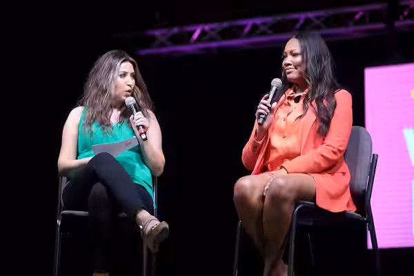 Allison Rodriguez and Garcelle Beauvais speaking with attendees at the 2022 Arizona Ultimate Women's Expo at the Phoenix Convention Center in Phoenix, Arizona. 