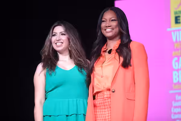 Allison Rodriguez and Garcelle Beauvais speaking with attendees at the 2022 Arizona Ultimate Women's Expo at the Phoenix Convention Center in Phoenix, Arizona. 