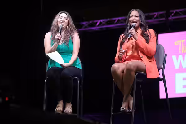 Allison Rodriguez and Garcelle Beauvais speaking with attendees at the 2022 Arizona Ultimate Women's Expo at the Phoenix Convention Center in Phoenix, Arizona. 