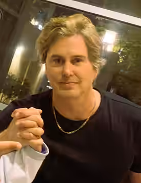 Greg Sestero poses with fans prior to a midnight screening of The Room in Claremont, California on March 2, 2024.