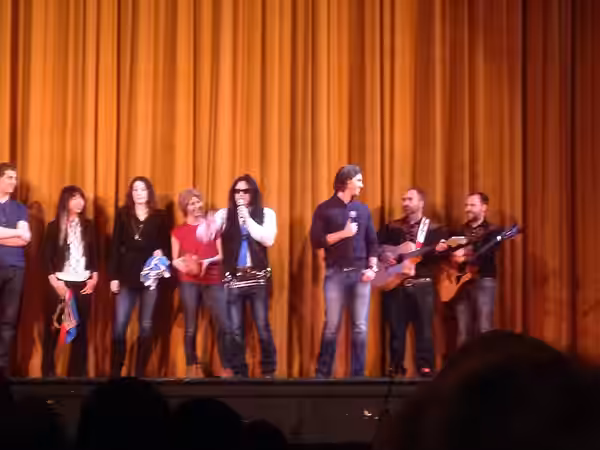 Tommy Wiseau, Greg Sestero, local musicians The Karpinka Brothers and some audience members on stage at the Roxy Theatre. Wiseau and Sestero took questions from (2014)
