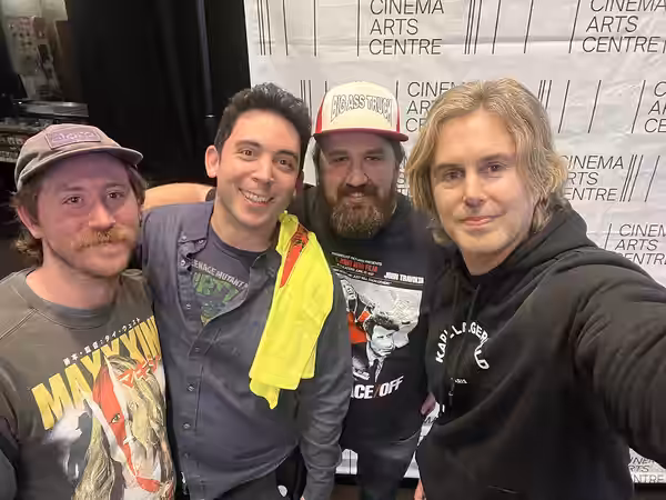 Sestero poses with fans during a screening of The Room in 2025
