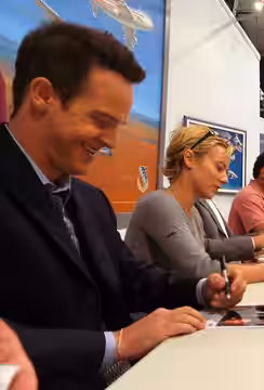 EDWARDS AIR FORCE BASE, Calif. -- Jason Gray-Stanford and Traylor Howard singning autographs at Edwards AFB. More than 200 people received autographs from the c