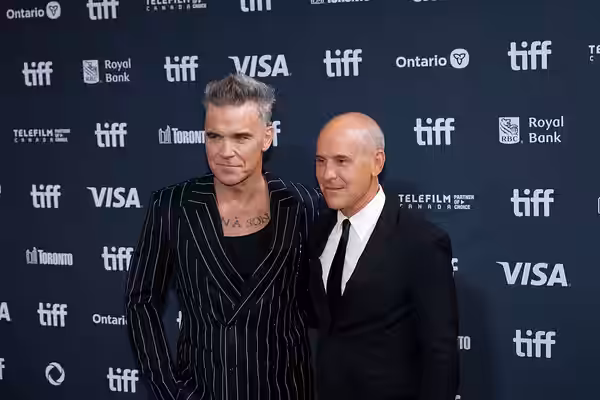 Robbie Williams and Brian Robbins at the 2024 Toronto International Film Festival (TIFF) for the movie Better Man.