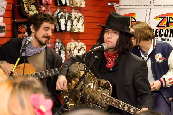 The band 100 Monkeys at Zia Records Chandler-5944 in December 2009. Actor/musician Jackson Rathbone is the on on the left, wearing the hat.
