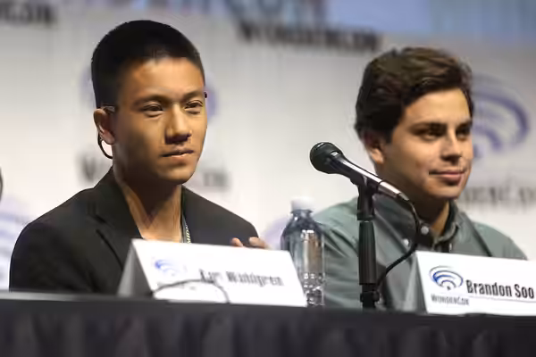 Brandon Soo Hoo and Jake T. Austin speaking at the 2017 WonderCon, for "Teen Titans: The Judas Contract", at the Anaheim Convention Center in Anaheim, Californi