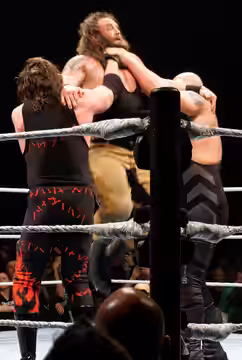 Big Show and Kane performing Double Chokeslam on Braun Strowman (2016)