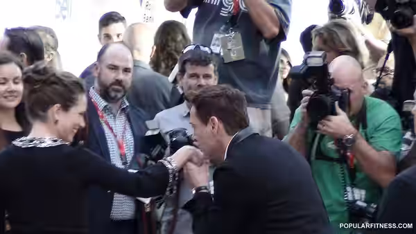 A nice guy and always a gentleman, Robert Downey Jr kissing his wife's hand at the movie premiere for The Judge at 2014 TIFF, red carpet event.