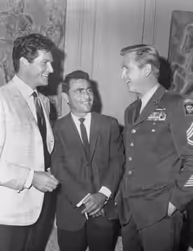 Photo of Hugh O'Brian, Rod Serling and Lloyd Bridges discussing the Chrysler Theater presentation Exit From a Plane in Flight. O'Brian and Bridges appeared in t