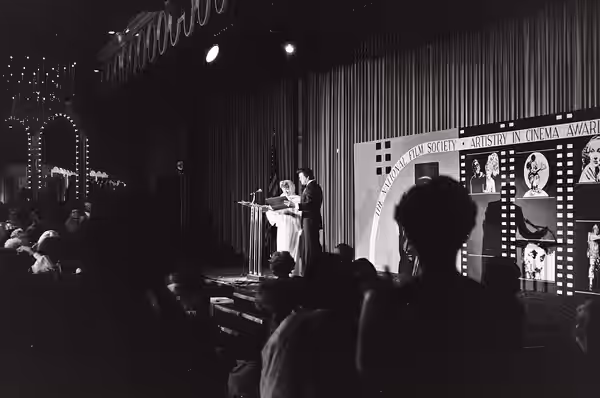 Ida Lupino is presented with a 1979 Artistry in Cinema Award by Earl Holliman at the National Film Society convention, May 1979. NOTE: Permission granted to cop
